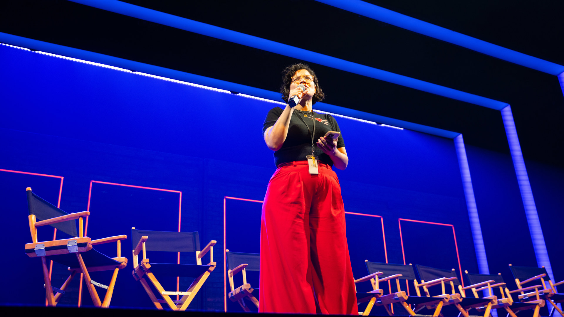 actress on stage with microphone